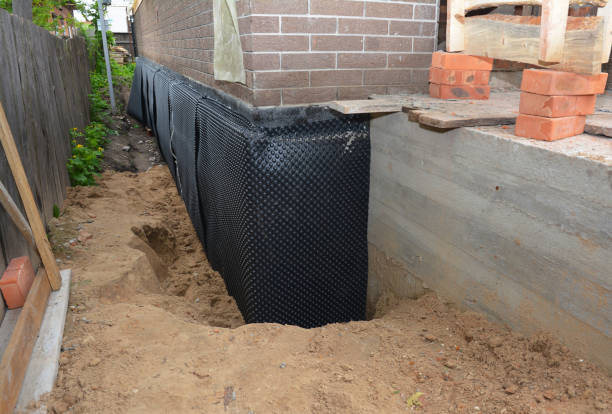 SJ Waterproofing Pros technician performing targeted Basement Waterproofing assessment in Wyocena, WI